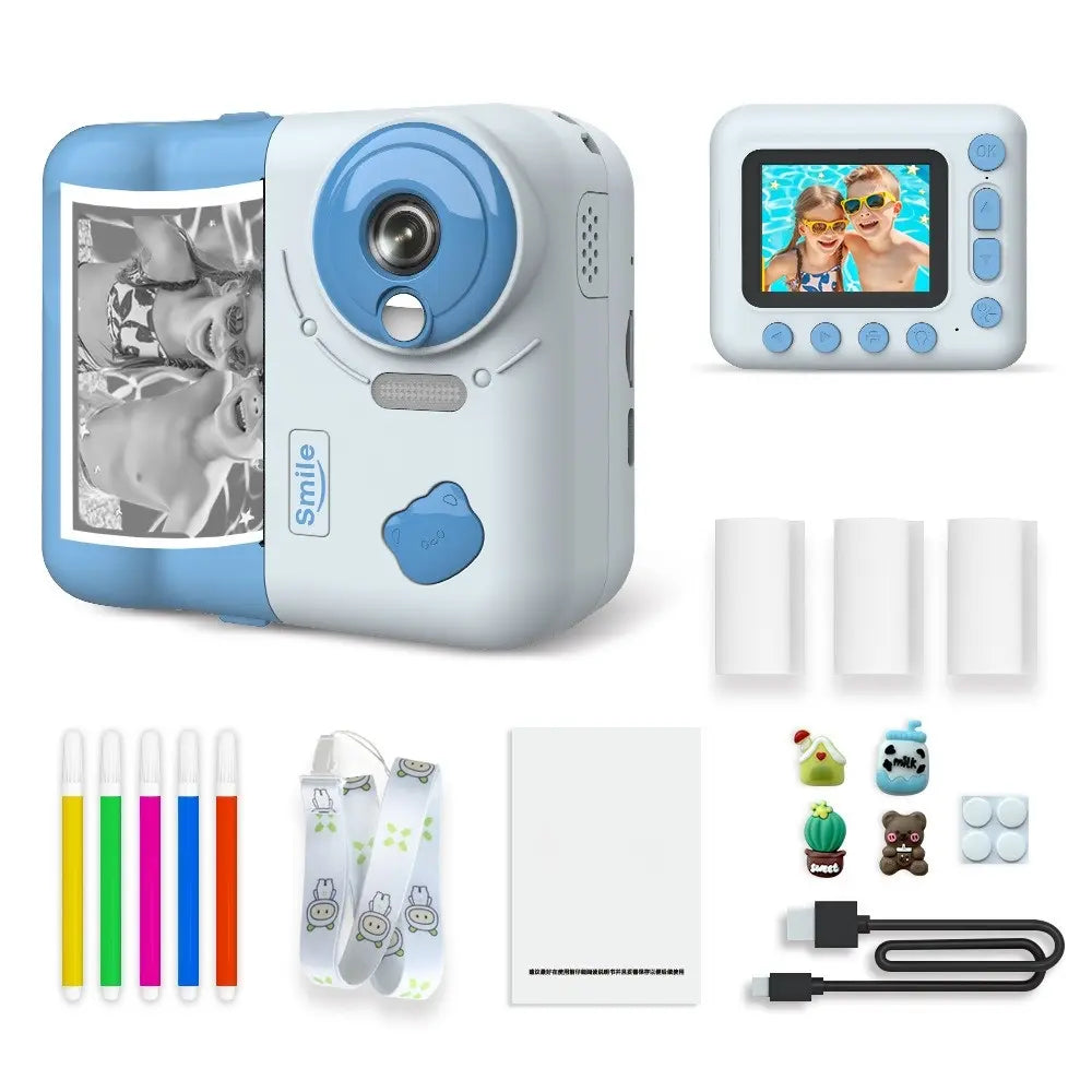 Appareil photo instantané enfant PrintJoy bleu et blanc, vues avant et arrière, avec tirage noir et blanc, rouleaux et accessoires. Bleu