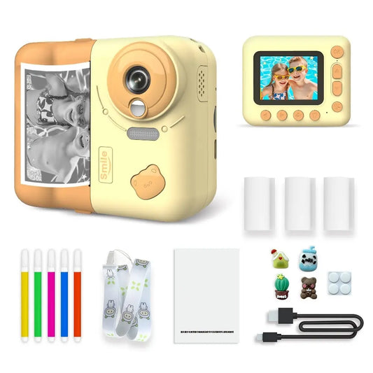 Appareil photo instantané enfant PrintJoy bleu et blanc, vues avant et arrière, avec tirage noir et blanc, rouleaux et accessoires. Jaune