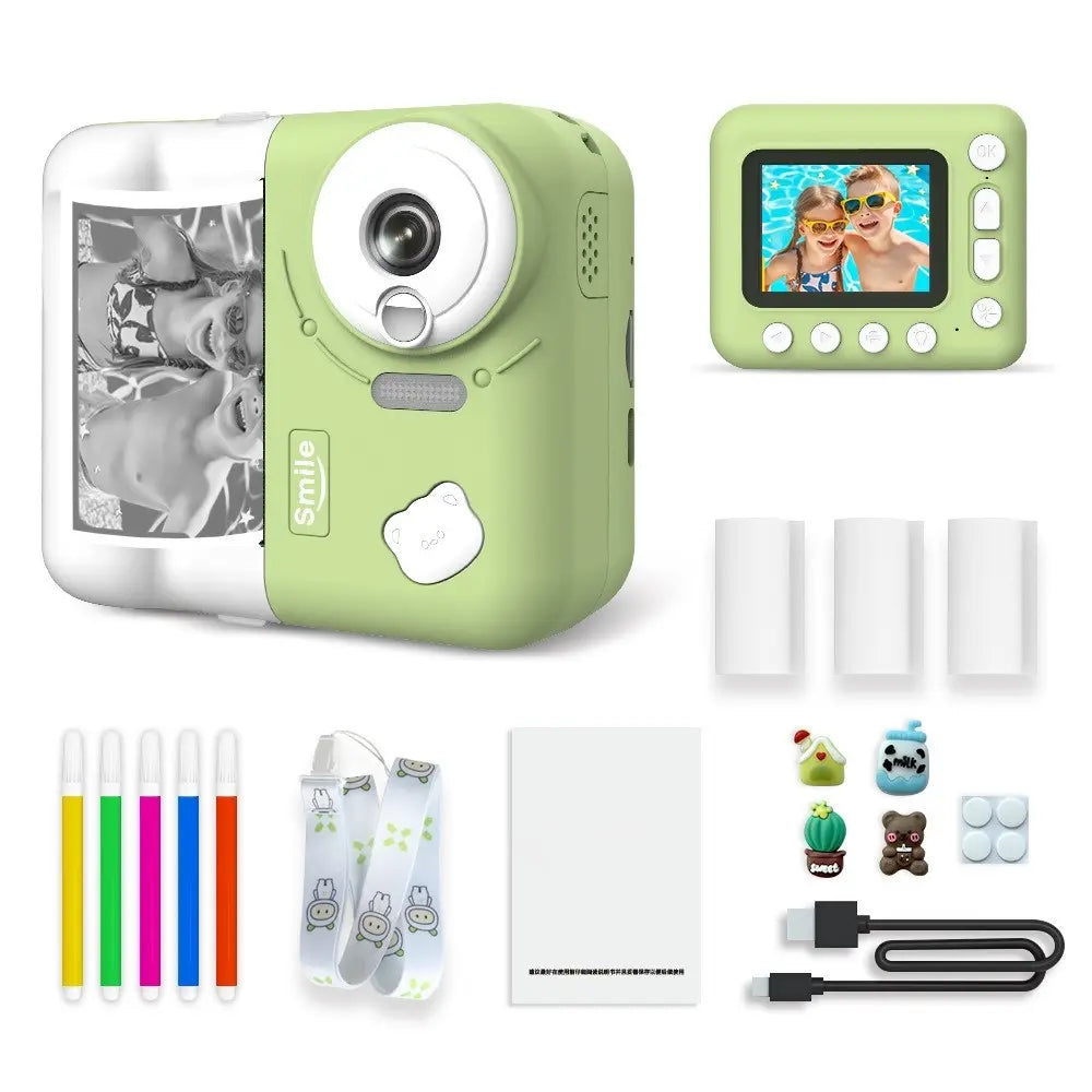 Appareil photo instantané enfant PrintJoy bleu et blanc, vues avant et arrière, avec tirage noir et blanc, rouleaux et accessoires. Vert