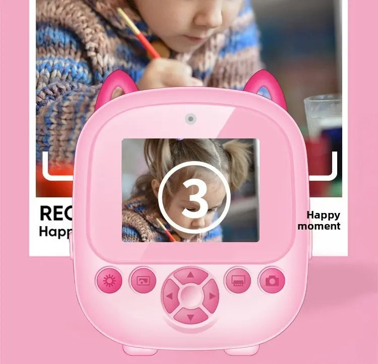 Écran de PrintPix™ rose affichant un compte à rebours de trois secondes devant l’image d’un enfant en train de dessiner.