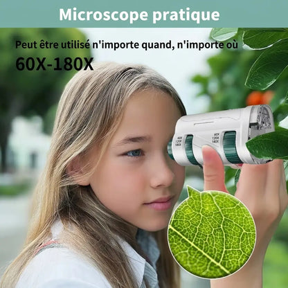 Microscope enfant portable MicroLab utilisé par une enfant pour examiner une feuille directement à travers l’oculaire.
