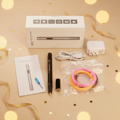 Contenu du pack stylo 3D enfant : stylo, câble USB, adaptateur, manuel, filaments PLA, sur fond beige ambiance cadeau